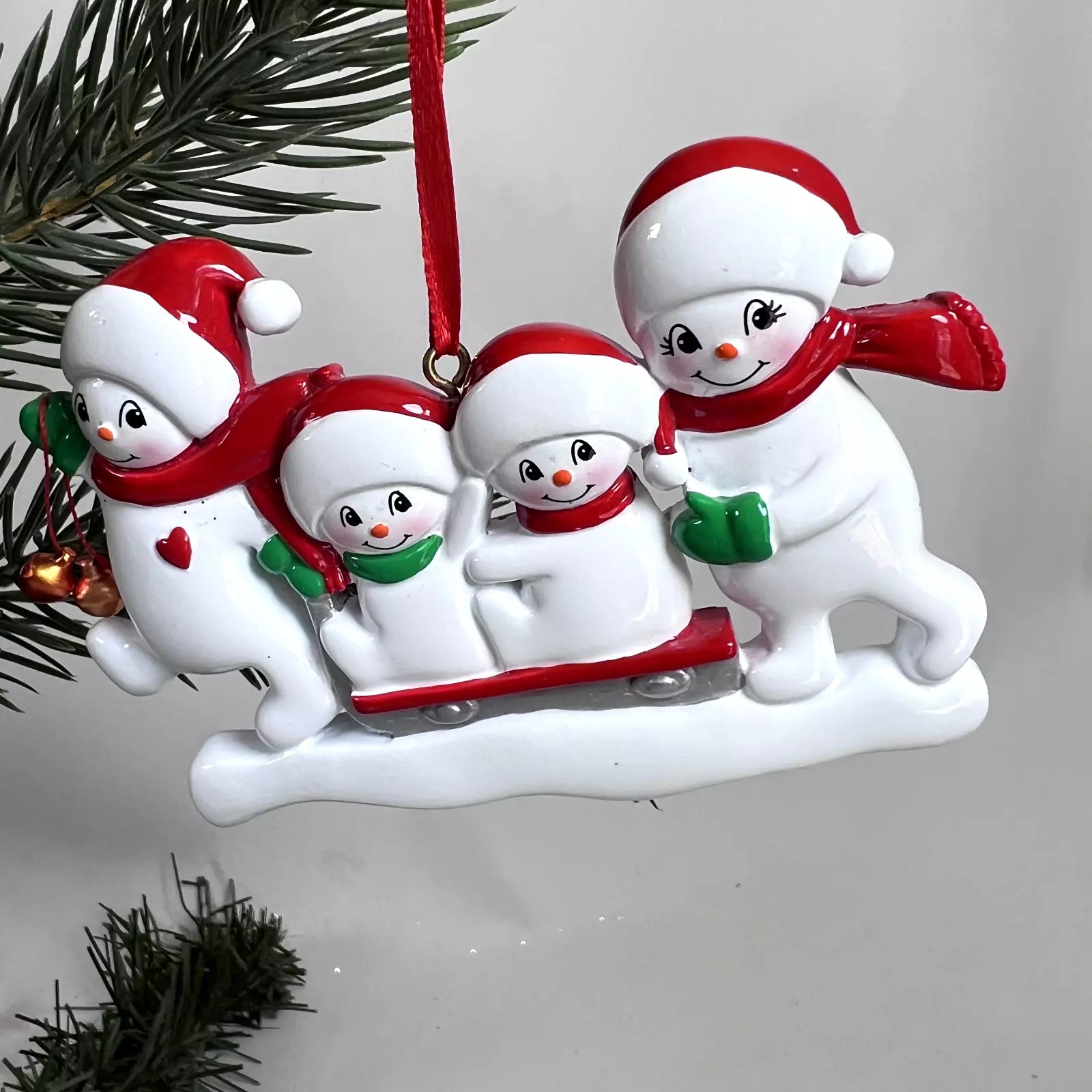 Snowmen Sled Family Of 4 Personalize Ornament